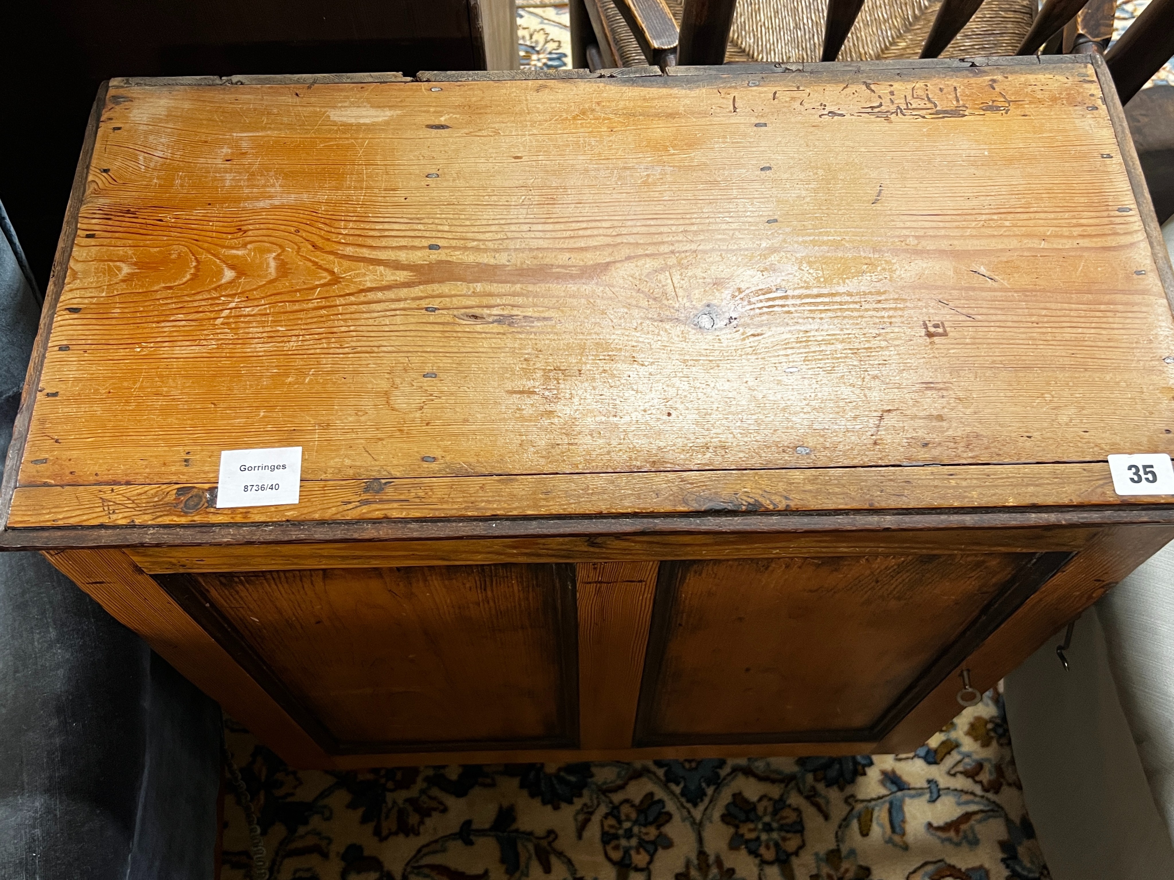 A 19th century French pine side cupboard with pigeonholed interior, width 63cm, depth 31cm, height 80cm